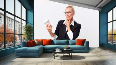 pretty blond adult businesswoman with a take away coffee Wall mural