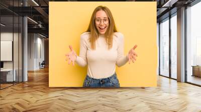 pretty caucasian woman feeling happy, astonished, lucky and surprised, like saying omg seriously? Unbelievable Wall mural