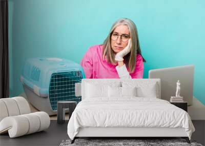 senior gray hair woman feeling bored, frustrated and sleepy after a tiresome. veterinarian concept Wall mural