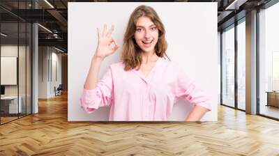 teenager young girl feeling successful and satisfied, smiling with mouth wide open, making okay sign with hand Wall mural