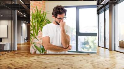 young adult crazy man with expressive pose at a modern house interior Wall mural