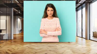 young adult pretty woman feeling displeased and disappointed, looking serious, annoyed and angry with crossed arms Wall mural