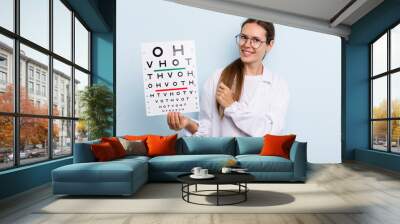 young adult woman feeling happy and facing a challenge or celebrating. optical vision test concept Wall mural