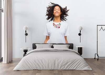 young cool african american woman looking extremely happy and surprised, celebrating success, shouting and jumping Wall mural