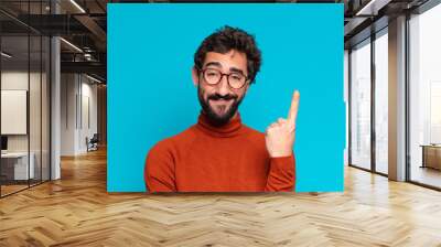 young crazy bearded man proud expression. copy space concept Wall mural