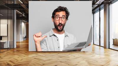 young crazy bearded man. shocked or surprised expression. laptop concept Wall mural