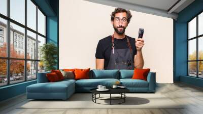 young man looking goofy and funny with a silly cross-eyed expression, joking and fooling around Wall mural