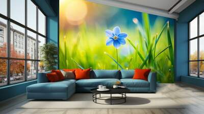 A beautiful small blue flower on lush green grass Wall mural