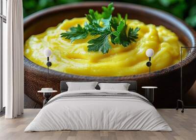 A Bowl of Creamy Yellow Mashed Potatoes Topped with Parsley, a Simple and Comforting Dish Wall mural