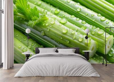 Fresh celery sticks with water drops, representing organic green health food Wall mural