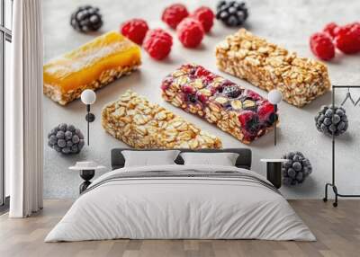 Isolated granola and muesli bars Nutritious sweet snack for fitness enthusiasts rich in fiber and featuring fruit and berries on a plain background Wall mural