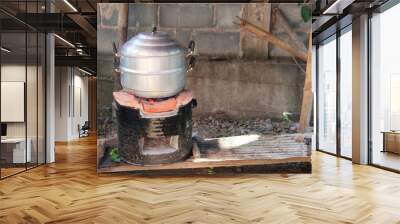 Aluminium steamer on fire wood charcoal stove Wall mural