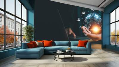 Businessman holding Global network connection. Big data analytics and business intelligence concept. World map point and line composition concept of global business. Wall mural