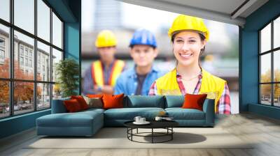 Young female engineer smile and stand with success engineer team Wall mural