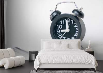 The black alarm clock has a white background. Wall mural