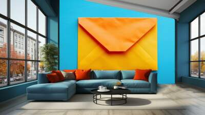 Vibrant Orange Envelope on a Blue Background Wall mural