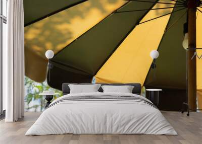 Croppe image of vintage two tone color fabric texture of umbrella for background. Wall mural