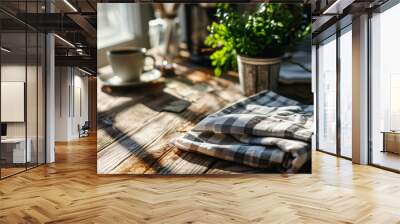 Top and close-up view of a cozy scene in domestic life, composition with Kitchen towel, coffee mug, and plants on a rustic wooden table. Wall mural