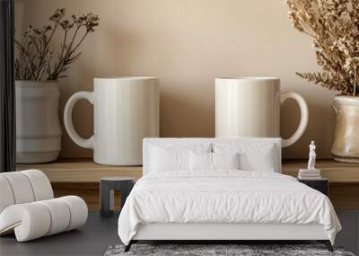 Two white blank mug mockups on a shelf, with sunlight and shadows, and dried flowers in vases.
 Wall mural