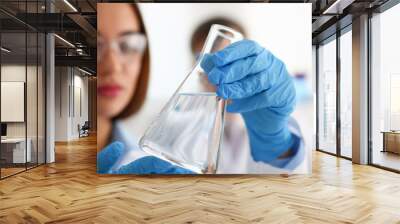 Female technician arms in protective gloves hold Wall mural