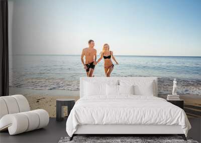 loving couple on the beach Wall mural