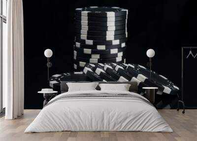 stack of black casino chips on a reflective surface Wall mural