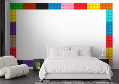 Color frame composed of coloured plastic toy blocks. Colorful brick banner. Abstract vector background Wall mural