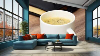 closeup of black coffee cup on the table Wall mural