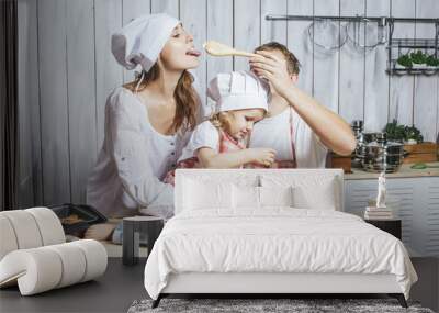 Family, happy daughter with mom and dad at home in the kitchen l Wall mural