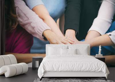 Group of women in the office at the seminar together discuss topics of interest hands close up Wall mural