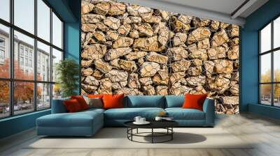 Gabion wall as an abstract background. Strengthening walls and banks with stones in a metal mesh Wall mural