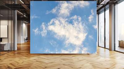 White clouds on a blue sky as a background for design Wall mural