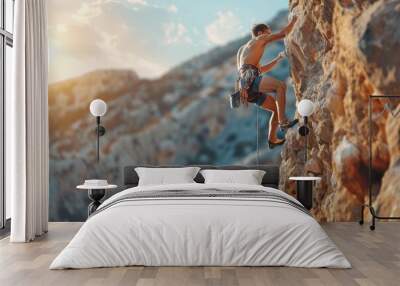 Man Climbing Rocky Cliff at Sunset with Safety Gear Wall mural