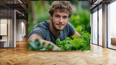 Young Man Smiling in Organic Vegetable Garden Wall mural