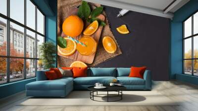 Fresh sliced orange and orange juice Wall mural