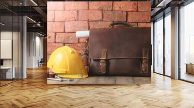 vintage leather bag with safety helmet and tool Wall mural