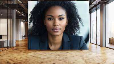 a businesswoman of color leading a meeting, confident expression and modern office background, capturing the power of representation Wall mural