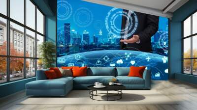 business man with the technology over internet of things world and blurred of night modern city background Wall mural