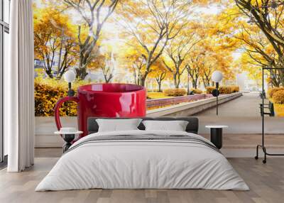 red coffee cup on park background Wall mural