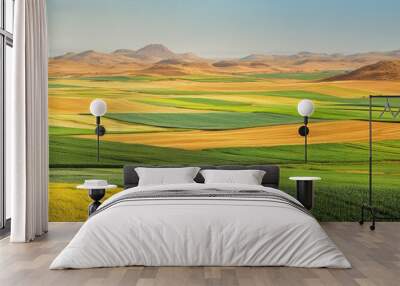 The green fields of farmland meet a desert landscape, where the vibrant crops contrast with the golden sands Wall mural