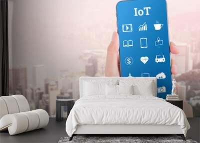 woman hand using smart phone in concept internet of things in bl Wall mural