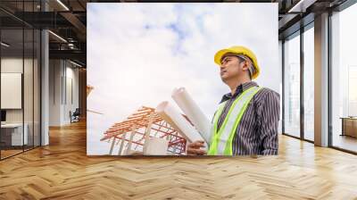 Asian business man construction engineer worker at house building site Wall mural