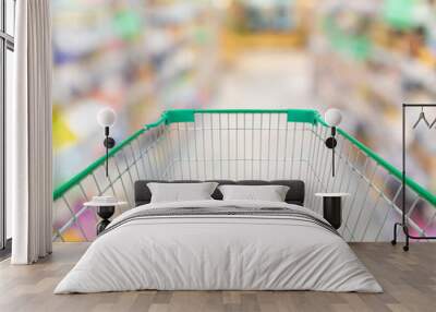 empty shopping cart in supermarket grocery store background Wall mural