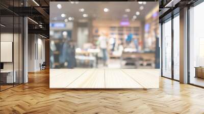 Empty wood table top with abstract blur clothing store in modern shopping mall defocused background Wall mural