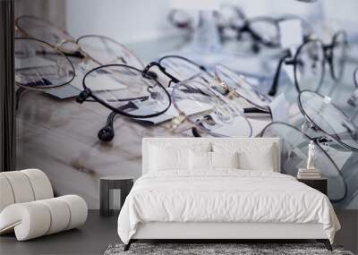 Eye glasses on window display shelves in optics store Wall mural