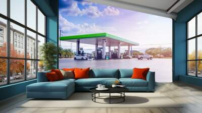 Gas station with clouds and blue sky Wall mural