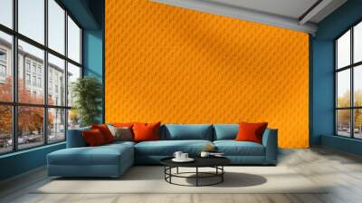 Orange color sports clothing fabric jersey football shirt texture top view Wall mural