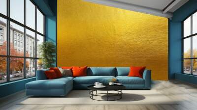 Gold wall texture background. Yellow shiny gold foil paint on wall sheet with gloss light reflection, vibrant golden paper luxury wallpaper Wall mural