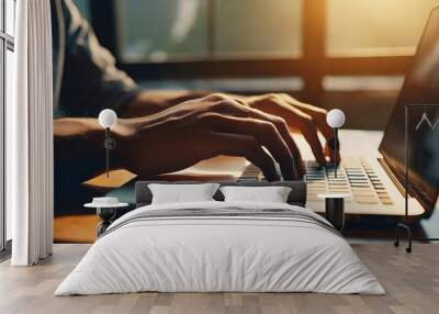 Male hands are typing on a laptop keyboard, a man works, develops a business  Wall mural