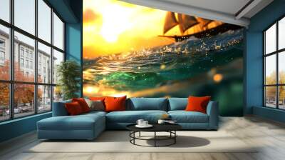 A sailboat sails through a turquoise ocean at sunset. The sun is setting behind the sails, casting a golden glow over the water. Wall mural